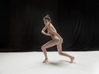 Image showing Young teen dancer on white floor background.