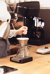 Image showing Barista, cafe, making coffee, preparation and service concept