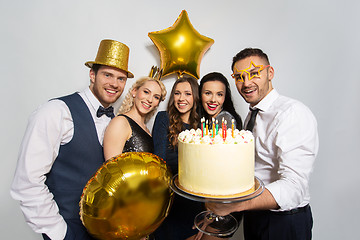 Image showing happy friends with big cake at birthday party