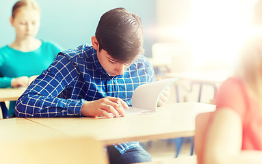 Image showing group of students with books writing school test