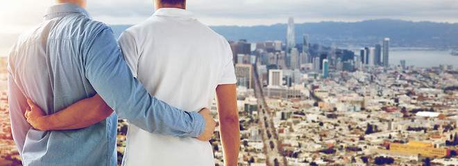 Image showing close up of gay couple hugging over san francisco