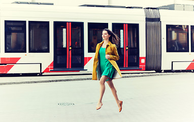 Image showing happy young woman or teenage girl on city street