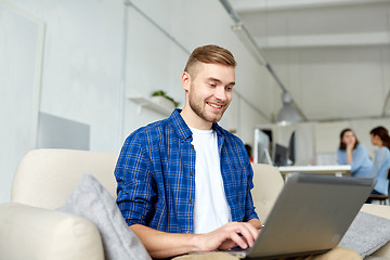 Image showing man with laptop working at office