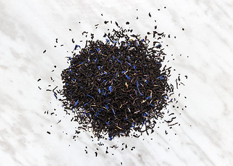 Image showing Black Earl gray tea leaves on marble background