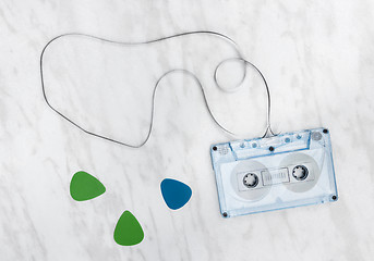 Image showing Blue audio tape and guitar picks