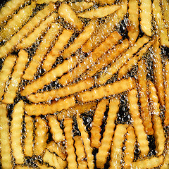 Image showing frying potatoes in hot oil