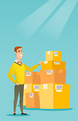 Image showing Business man checking boxes in warehouse.