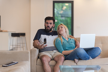 Image showing young happy couple relaxes in the living room