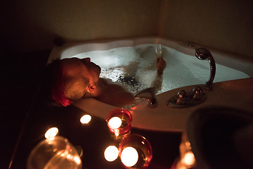 Image showing man relaxing in the jacuzzi