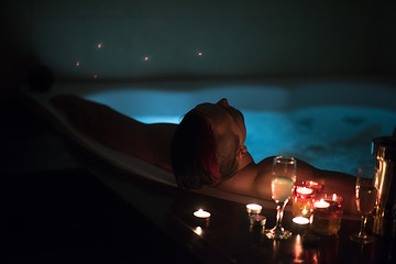 Image showing man relaxing in the jacuzzi