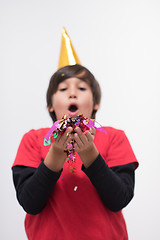 Image showing kid blowing confetti