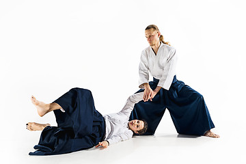 Image showing Man and woman fighting at Aikido training in martial arts school