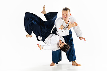 Image showing Man and woman fighting at Aikido training in martial arts school