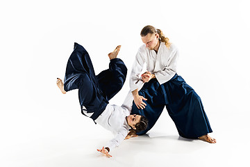 Image showing Man and woman fighting at Aikido training in martial arts school