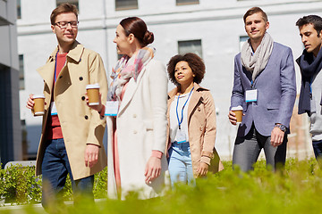 Image showing office workers with coffee on city street