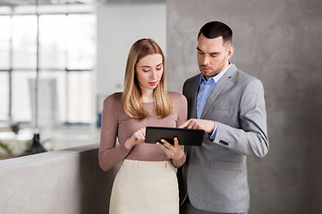 Image showing businesswoman and businessman with tablet pc