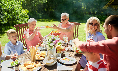 Image showing happy family having dinner or summer garden party