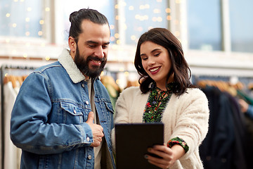 Image showing couple with tablet pc at vintage clothing store