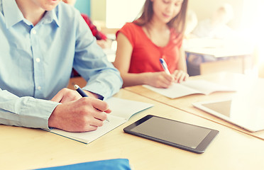 Image showing close up of students tablet pc writing at school