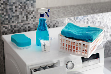 Image showing blue laundry powder and washing machine