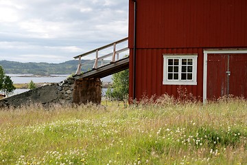 Image showing Red barn with bridge