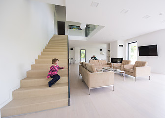 Image showing family with little girl enjoys in the modern living room