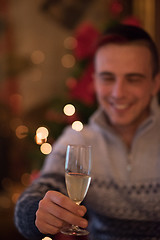 Image showing Happy young man with a glass of champagne