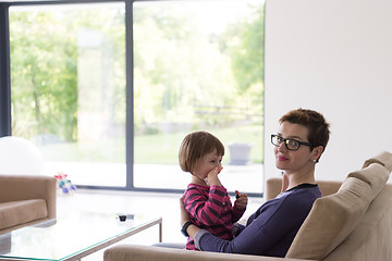 Image showing mother and cute little girl enjoying their free time