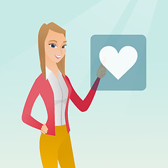 Image showing Young woman pressing heart shaped button.