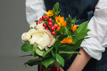 Image showing Woman holding a gorgeous bouquet