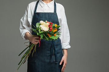 Image showing Woman holding a gorgeous bouquet