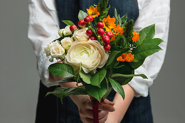 Image showing Woman holding a gorgeous bouquet