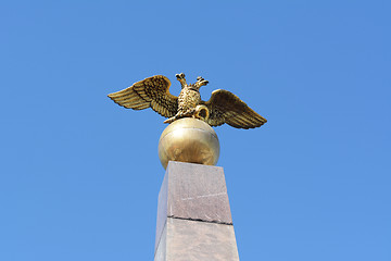 Image showing Golden two-headed eagle sculpture on obelisk