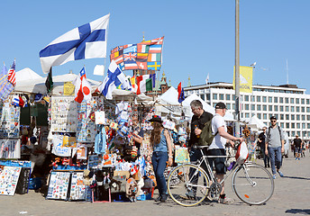 Image showing Tourists peruse a souvenir stall in Helsinki