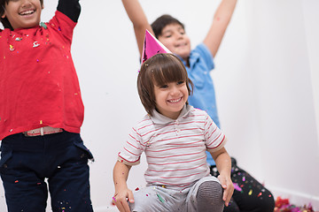 Image showing kids  blowing confetti