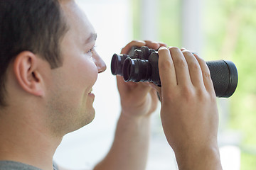 Image showing man looking with binoculars