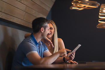 Image showing couple using tablet at home
