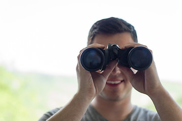 Image showing man looking with binoculars