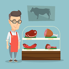 Image showing Butcher offering fresh meat in a butchershop.