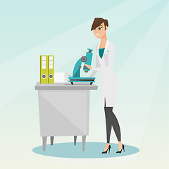 Image showing Laboratory assistant with a microscope.