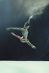 Image showing Young teen dancer on white floor background.