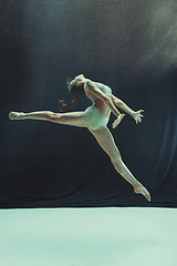 Image showing Young teen dancer on white floor background.