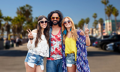 Image showing hippie friends showing peace at venice beach in la