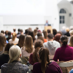 Image showing Woman giving presentation in lecture hall at university.