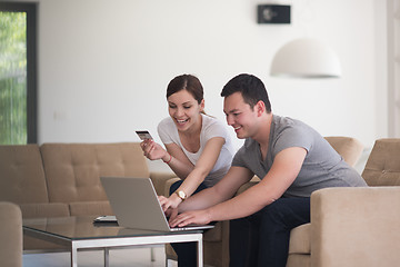 Image showing happy young couple buying online