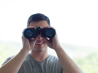 Image showing man looking with binoculars