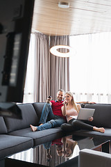 Image showing happy couple relaxes in the living room