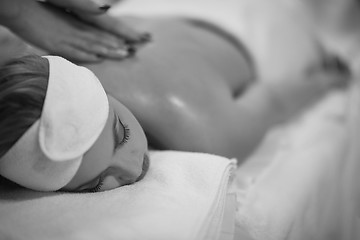 Image showing woman receiving a back massage