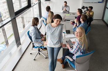 Image showing Pretty Businesswomen Using Tablet In Office Building during conf