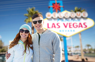 Image showing teenage couple in shades over las vegas sign